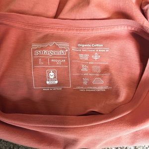 Used Patagonia responsibility t shirt. Men’s size Large. Salmon color